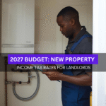 Black British property maintenance worker inspecting a boiler inside a UK rental property while reviewing documents.