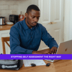 Black British delivery driver completing final Self Assessment paperwork at home.